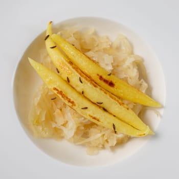 finger-shaped potato dumplings on Sauerkraut in a plate