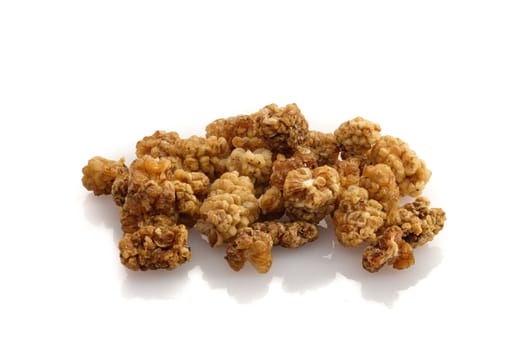 Close-up dried red mulberry fruits on white isolated