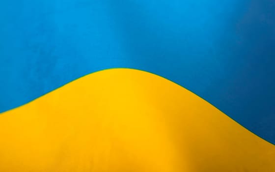 Flag of Ukraine. Blue and yellow colors. Close up shot, background