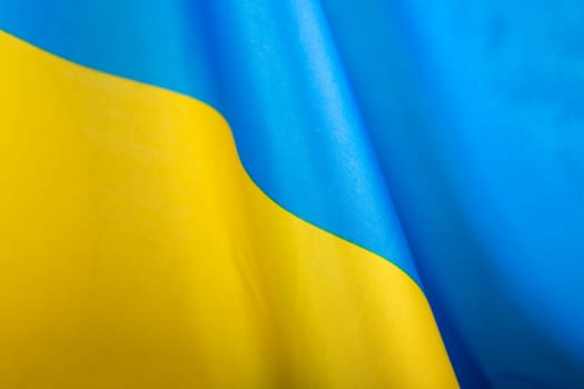 Flag of Ukraine. Blue and yellow colors. Close up shot, background