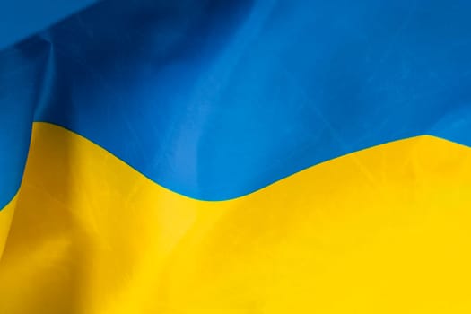 Flag of Ukraine. Blue and yellow colors. Close up shot, background