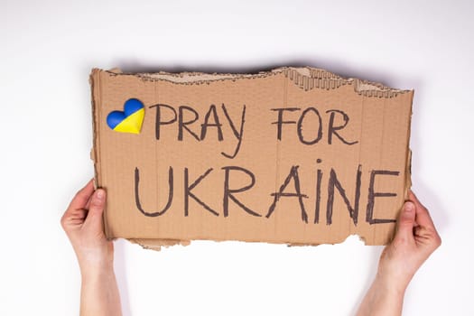 Pray for Ukraine concept background. Concept symbol of help support and no war in the country of Ukraine.