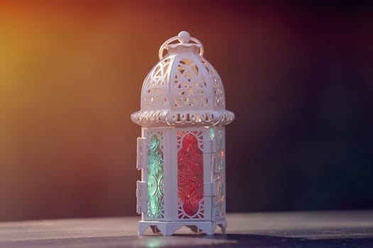 Ramadan Kareem background. Ornamental Arabic lantern glowing at night