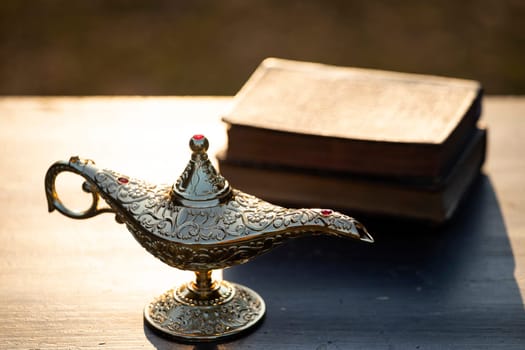 Ramadan Kareem festive greeting card for Muslim holy month with Aladdin lamp of wishes and Quran