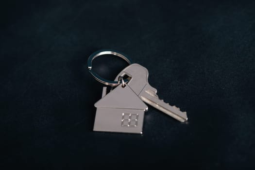 Keychain house with keys. Realtor, mortgage, your house, home loan concept. Copy space
