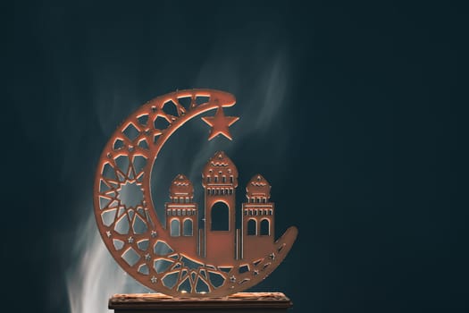 Ramadan Kareem background. Ornamental Arabic lantern glowing at night