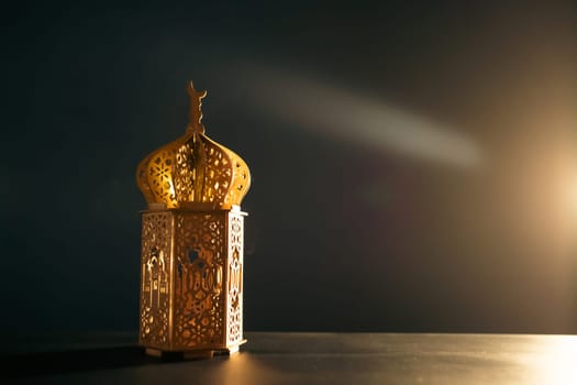Ramadan Kareem background. Ornamental Arabic lantern glowing at night