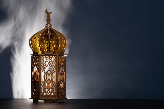 Ramadan Kareem background. Ornamental Arabic lantern glowing at night