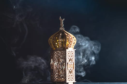 Ramadan Kareem background. Ornamental Arabic lantern glowing at night