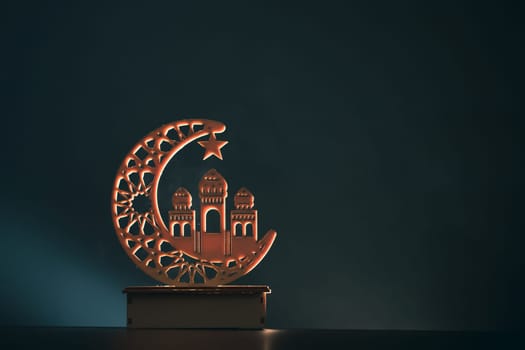 Ramadan Kareem background. Ornamental Arabic lantern glowing at night