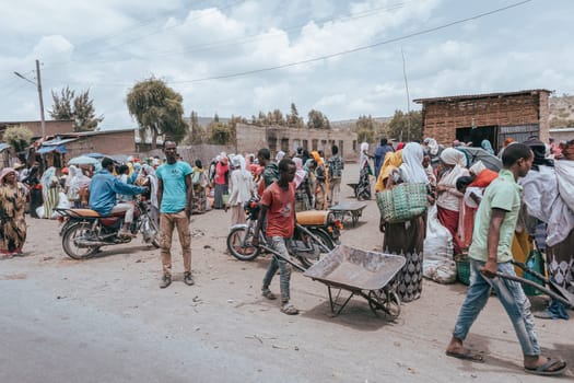 Aje, Oromia Region, Ethiopia - May 16, 2019: Ordinary people and their everyday life on street of city Aje, Oromia Region, Ethiopia, Africa