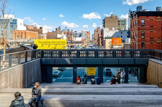 Observation Deck at High Line Rooftop Park, New York City with People sitting on staircase during sunny winter day advertisement Poster and Buildings in the background, horizontal