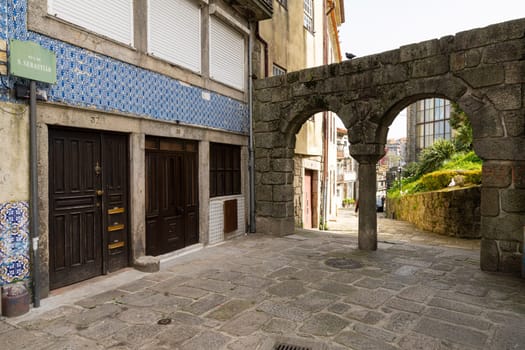 Porto, Portugal. March 2022. the passage between ancient arches in the u in the city center