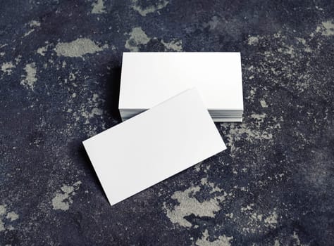 Blank business cards on concrete background. Mock-up for branding identity. Blank template for design presentations and portfolios.