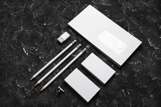 Blank stationery template on black plaster background. Mockup for branding identity for placing your design.