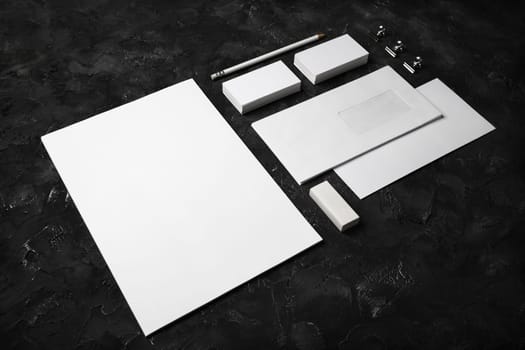 Blank stationery set on black plaster background. ID template. Mockup for branding identity for designers.