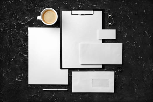 Corporate identity template on black plaster background. Photo of blank stationery set. Mockup for design presentations and portfolios. Flat lay.