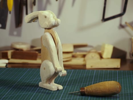 hare wooden toy on the table in the workshop