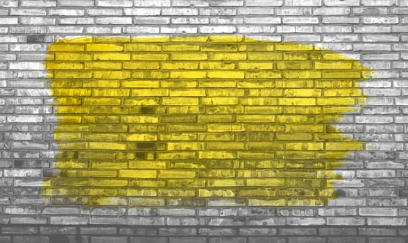 Brick wall background with yellow graffiti color