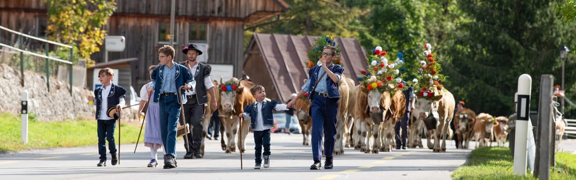 Charmey, Fribourg, Switzerland - 28 September 2019 : Farmers with a herd of cows on the annual transhumance at Charmey near Gruyeres, Fribourg zone on the Swiss alps