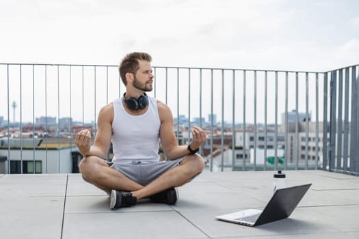 Handsome young man training and working out outdoors