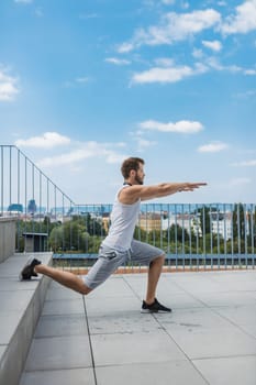 Handsome young man training and working out outdoors