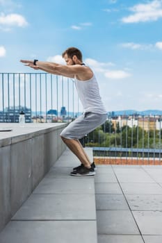 Handsome young man training and working out outdoors