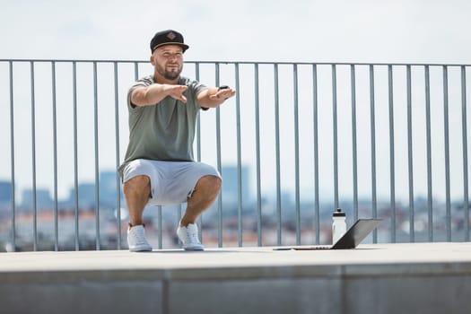 Handsome young man training and working out outdoors