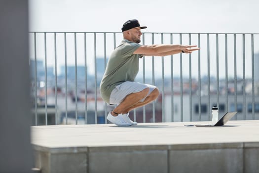 Handsome young man training and working out outdoors