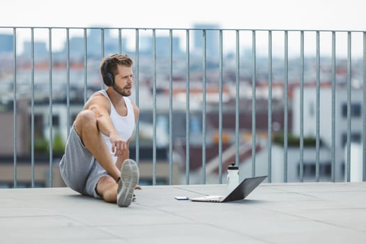 Handsome young man training and working out outdoors