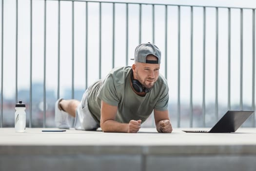 Handsome young man training and working out outdoors