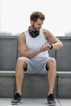 Handsome young man training and working out outdoors