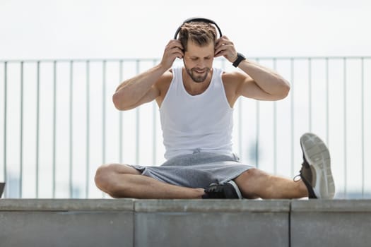 Handsome young man training and working out outdoors