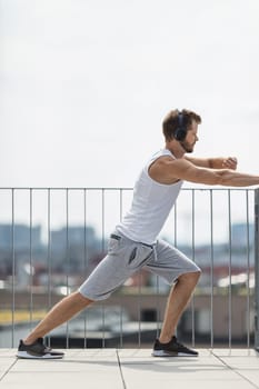 Handsome young man training and working out outdoors
