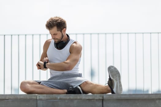 Handsome young man training and working out outdoors