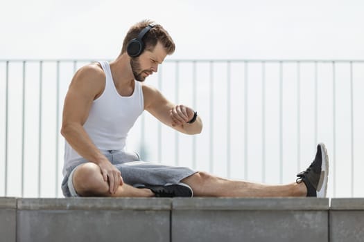 Handsome young man training and working out outdoors