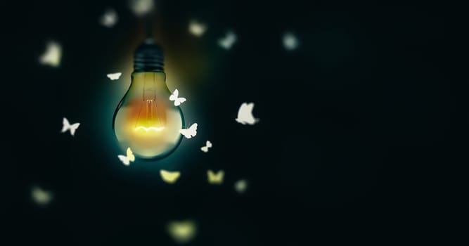 Luminous Bulb And Butterflies Flying On Light