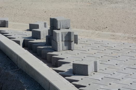 Laying of concrete pavements