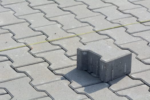 Laying of composite paving