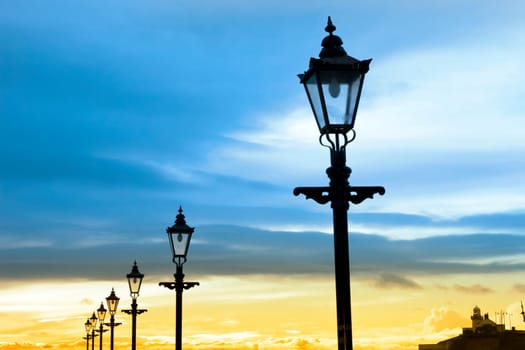 lighthouse and row of vintage lamps on the promenade in Youghal county Cork Ireland