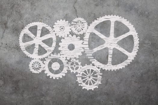Gears drawed with chalk on cement background
