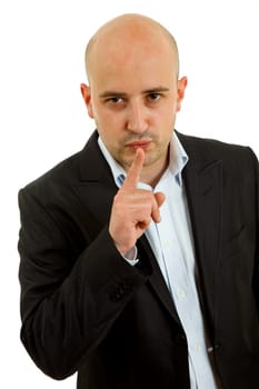 young man showing silence gesture with his finger in the mouth