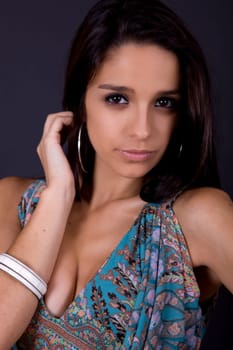 young beautiful brunette portrait against black background