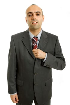business man adjusting his tie isolated on white