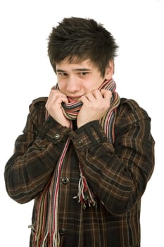 studio picture of a cold young man dressed for winter
