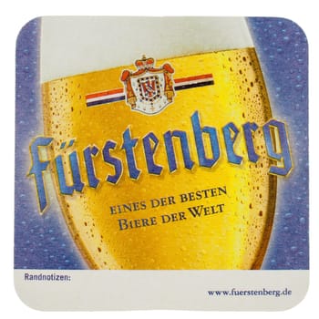 BERLIN, GERMANY - MARCH 15, 2015: Beermat of German beer Fuerstenberg isolated over white background