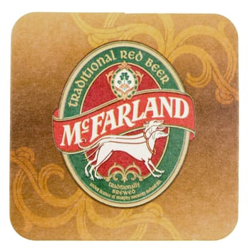DUBLIN, IRELAND - MARCH 15, 2015: Beermat of Irish beer McFarland isolated over white background