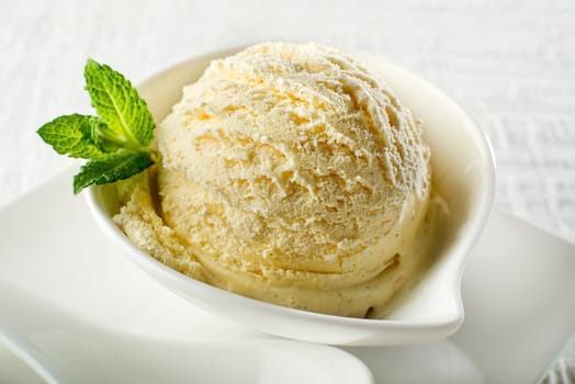 Ice cream in a bowl on white background