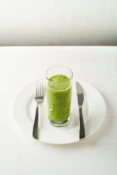 Glass of Healthy green smoothie with vegetables