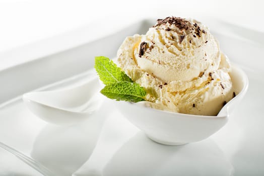 Ice cream in a bowl on white background